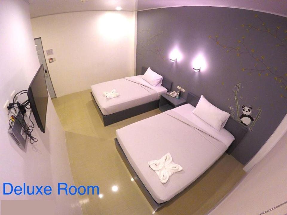 Postel nebo postele na pokoji v ubytování GC Suites