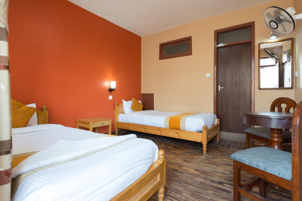 Postel nebo postele na pokoji v ubytování Khangsar Home
