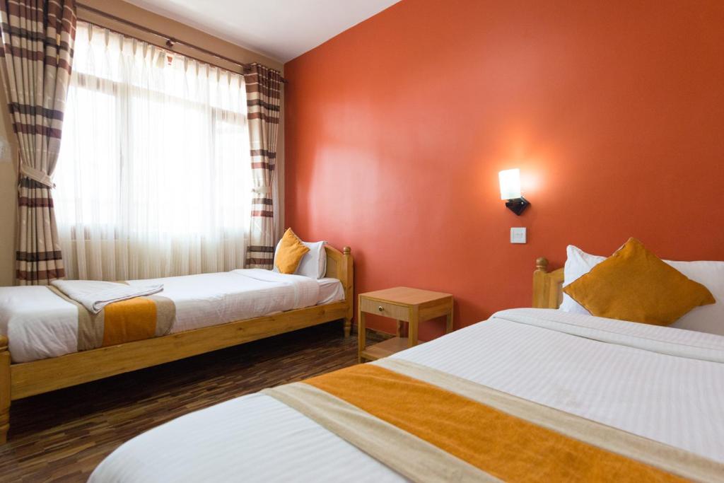 Postel nebo postele na pokoji v ubytování Khangsar Home