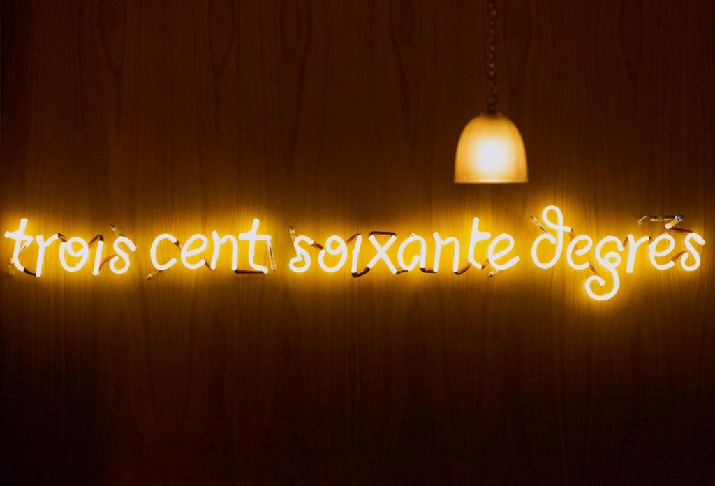 a neon sign that says tigers cant soxarma degrees at Dar El Marsa Hotel & Spa in La Marsa