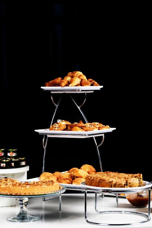 a three tiered display of food on three tiers at Dar El Marsa Hotel & Spa in La Marsa