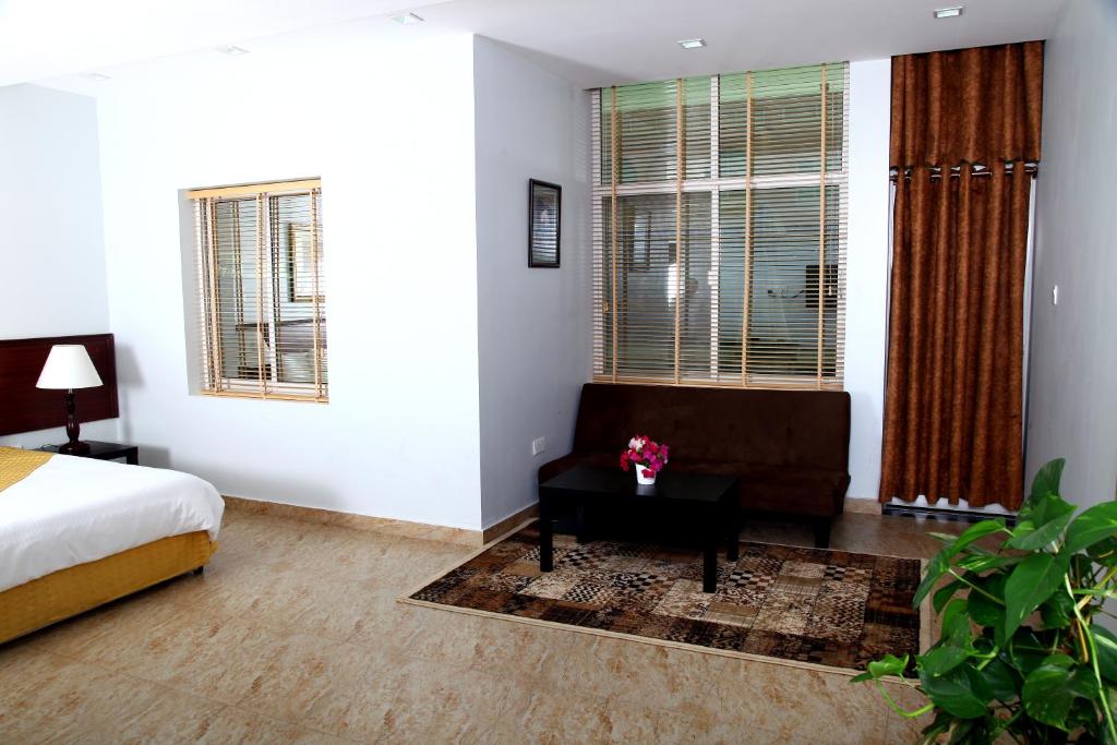 Postel nebo postele na pokoji v ubytování Al Dar Inn Hotel Apartment
