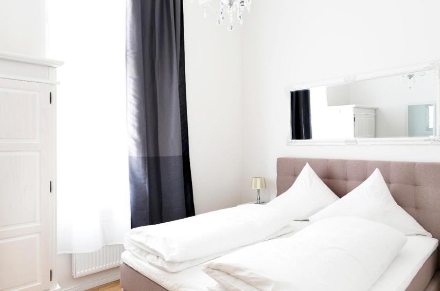Ein Bett oder Betten in einem Zimmer der Unterkunft SC 3 Cozy Family & Business Flair welcomes you - Rockchair Apartments