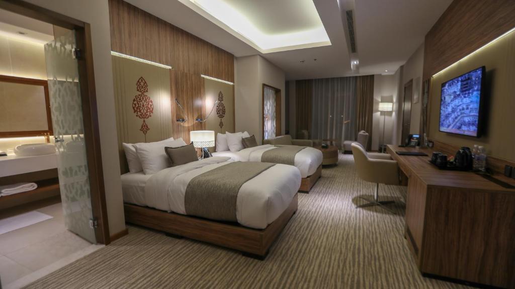 TV a/nebo společenská místnost v ubytování V Boutique Hotel