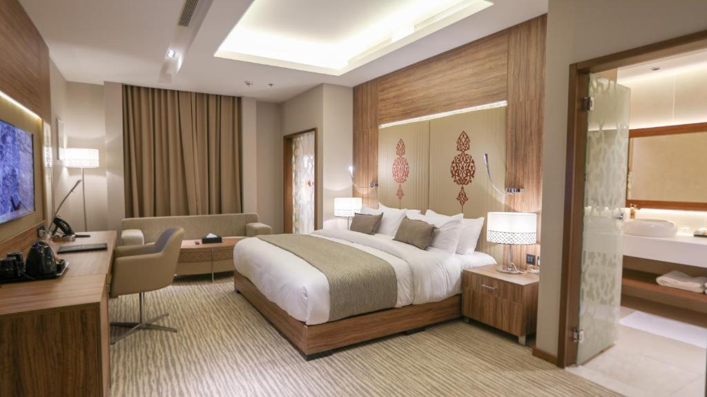 Postel nebo postele na pokoji v ubytování V Boutique Hotel