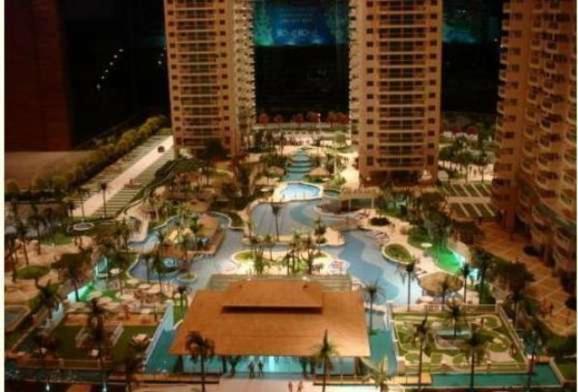 a view of a building with a water park at Barra da Tijuca Resort Bora Bora in Rio de Janeiro