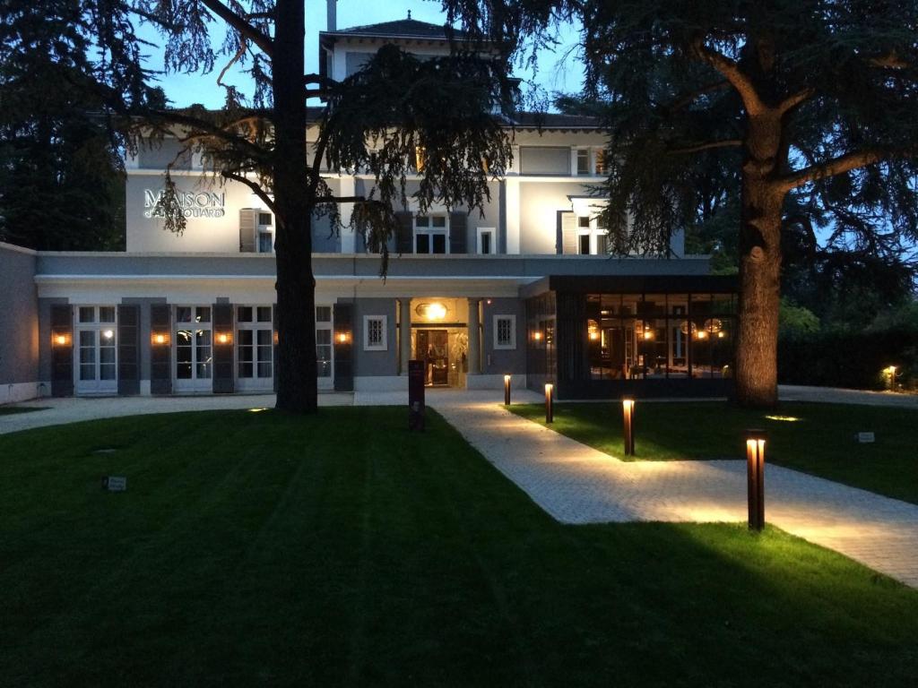 an exterior view of a building at night at Maison D'Anthouard in Écully