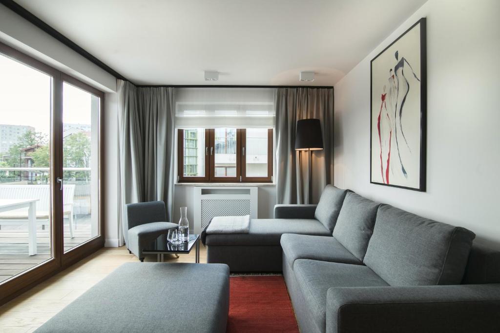Posezení v ubytování Apartment with Terrace and Sauna by Grand Apartments