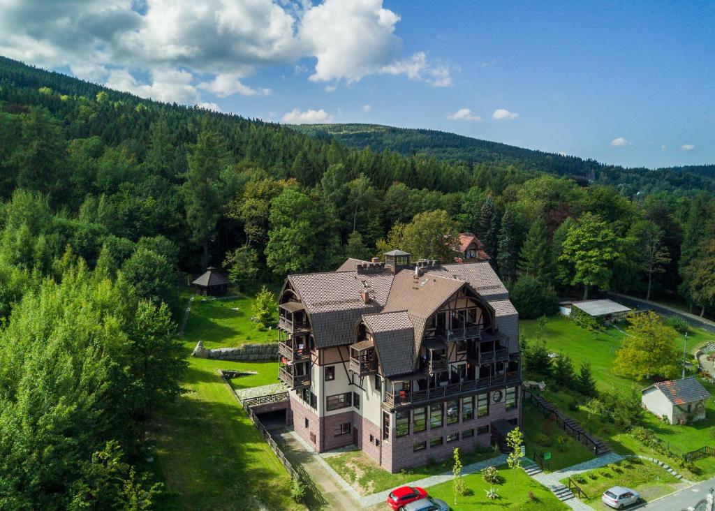 an aerial view of a large house in the woods at Boutique Hotel Sudetia - Medical & SPA in Świeradów-Zdrój
