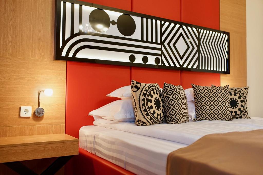 Postel nebo postele na pokoji v ubytování Astoria Hotel & SPA