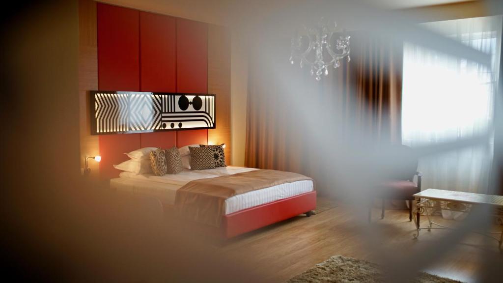 Postel nebo postele na pokoji v ubytování Astoria Hotel & SPA