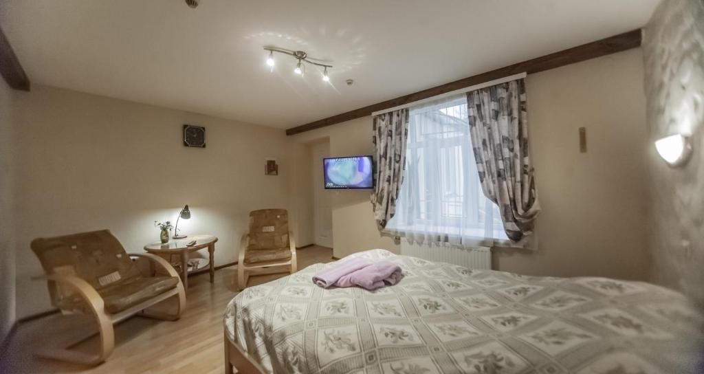 Postel nebo postele na pokoji v ubytování Leo