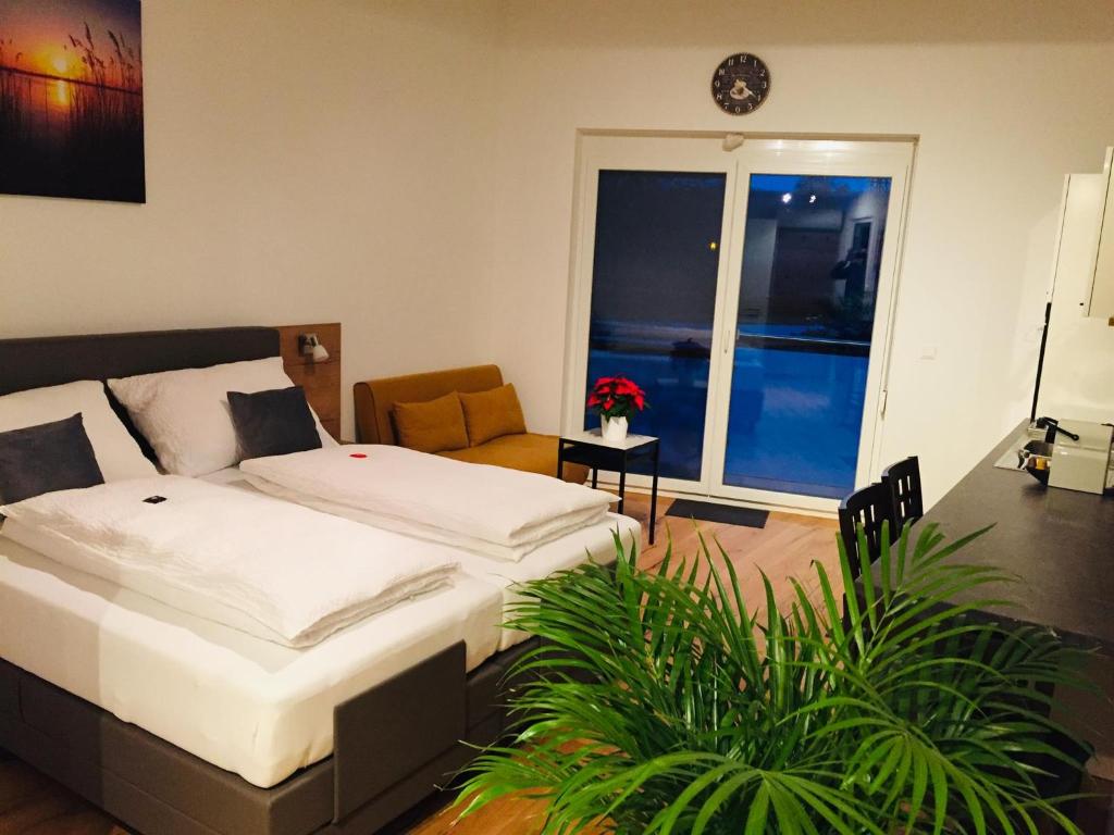 A bed or beds in a room at Sonnenweg Appartements