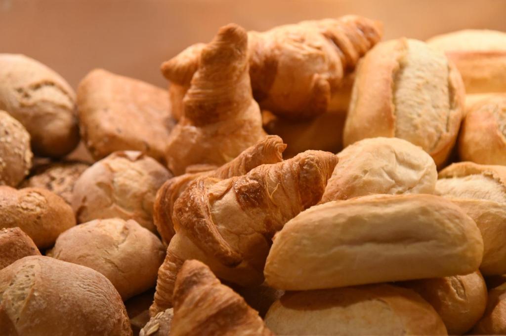 a pile of croissants and pastries are arranged at meinHotel in Hamburg