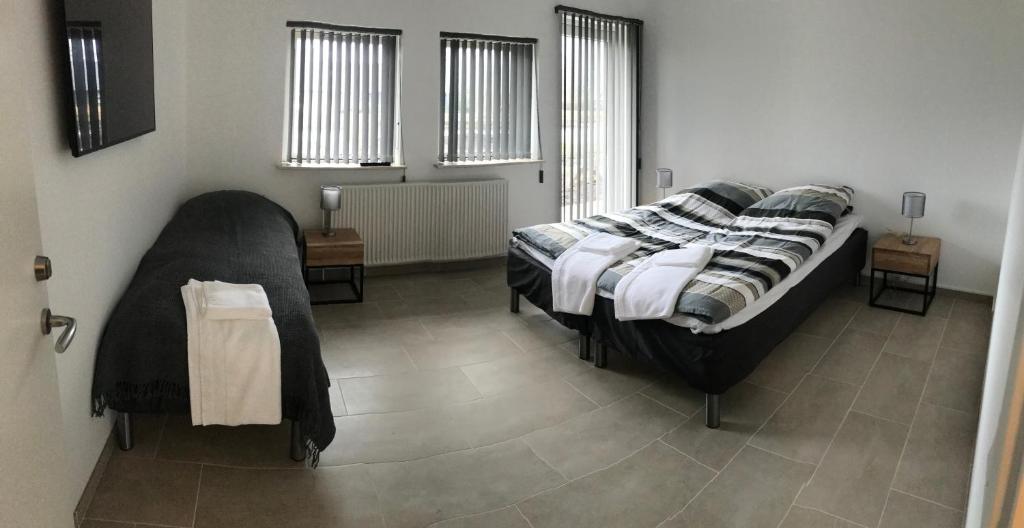 Ένα ή περισσότερα κρεβάτια σε δωμάτιο στο Hotel Ikast