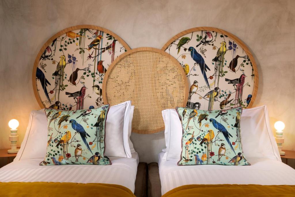 Postel nebo postele na pokoji v ubytování Palm Suites - Small Luxury Hotels of the World