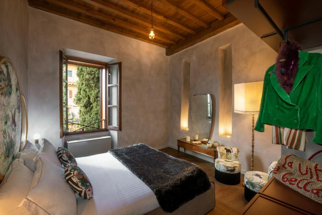 Postel nebo postele na pokoji v ubytování Palm Suites - Small Luxury Hotels of the World