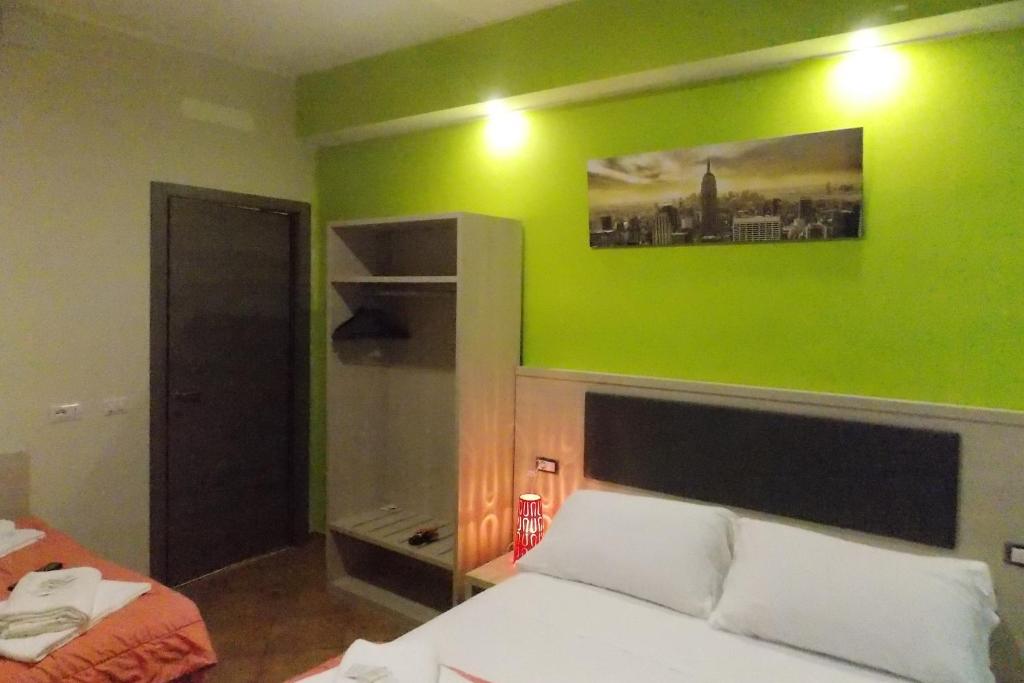 Postel nebo postele na pokoji v ubytování Hotel Midtown Milano