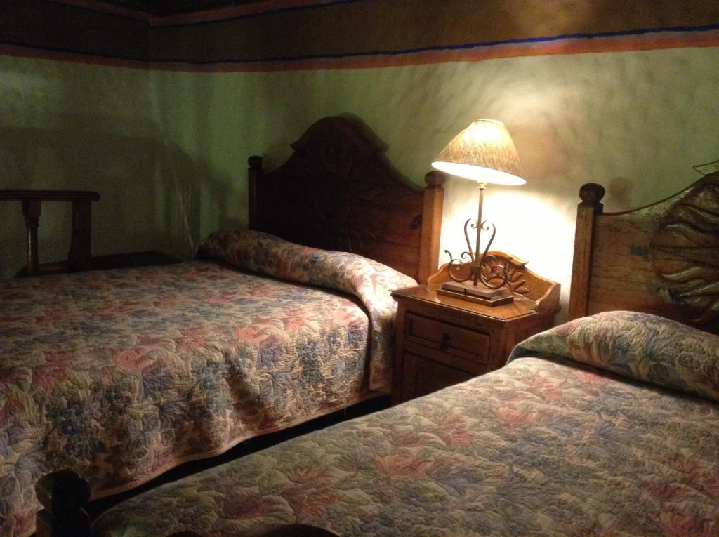 Postel nebo postele na pokoji v ubytování Hotel Los Escudos