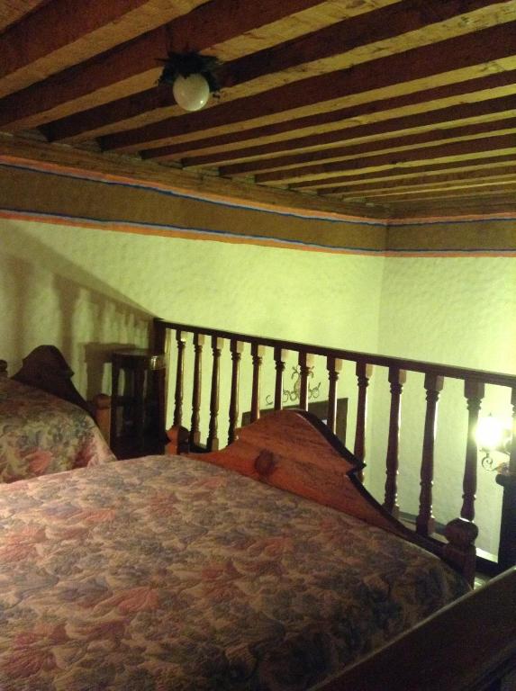 Postel nebo postele na pokoji v ubytování Hotel Los Escudos
