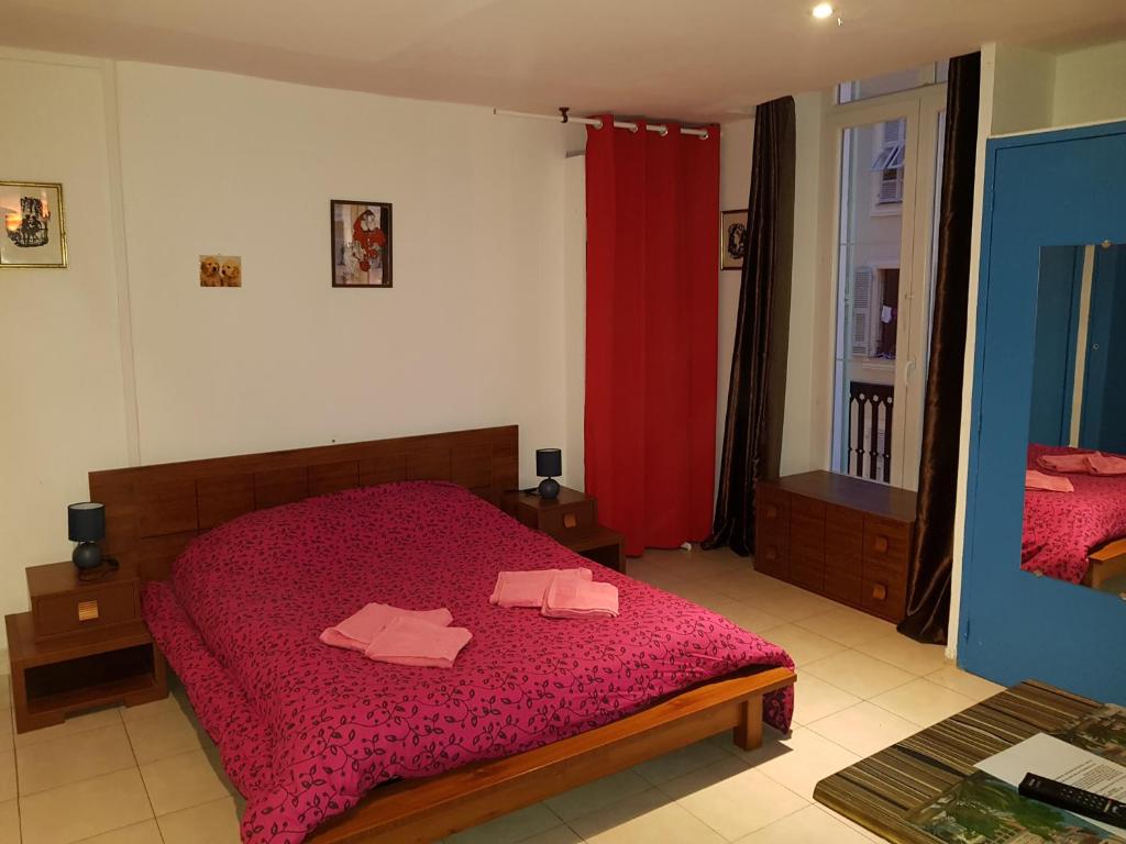 Ένα ή περισσότερα κρεβάτια σε δωμάτιο στο Résidence Appartement Adonis