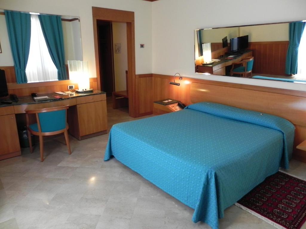 Postel nebo postele na pokoji v ubytování Hotel Vecchio Mulino