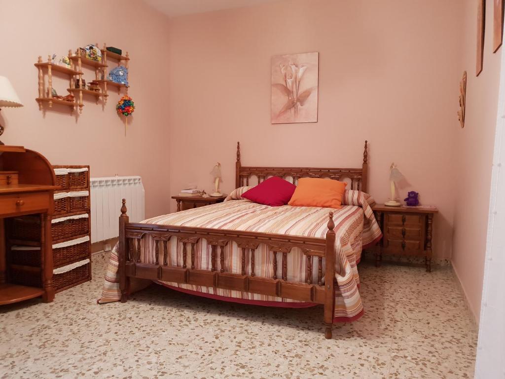 a bedroom with a bed and two night stands at Riocorvo in Rute