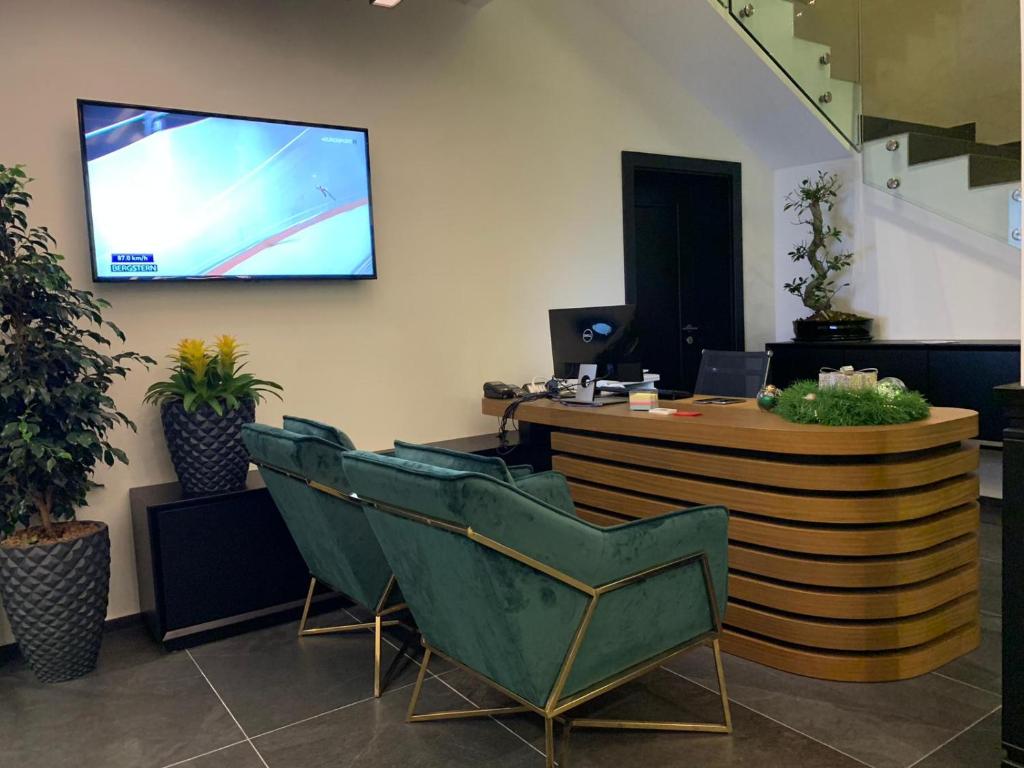 TV a/nebo společenská místnost v ubytování Hotel Rubis