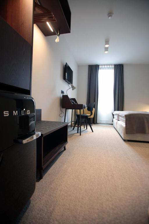 Postel nebo postele na pokoji v ubytování Hotel Mrak