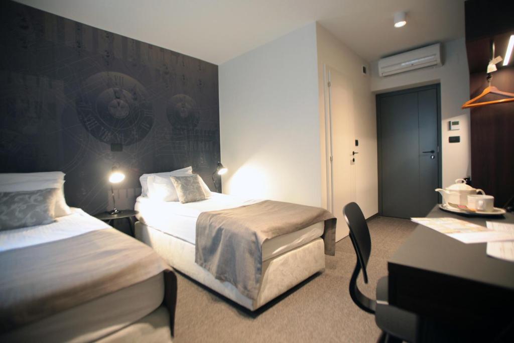 Postel nebo postele na pokoji v ubytování Hotel Mrak