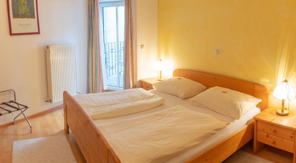 Postel nebo postele na pokoji v ubytování Hotel & Hostel Sandwirt