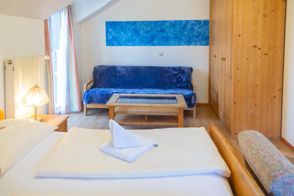 Postel nebo postele na pokoji v ubytování Hotel & Hostel Sandwirt