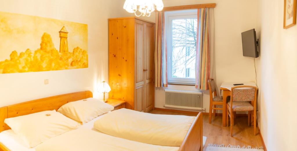 Postel nebo postele na pokoji v ubytování Hotel & Hostel Sandwirt
