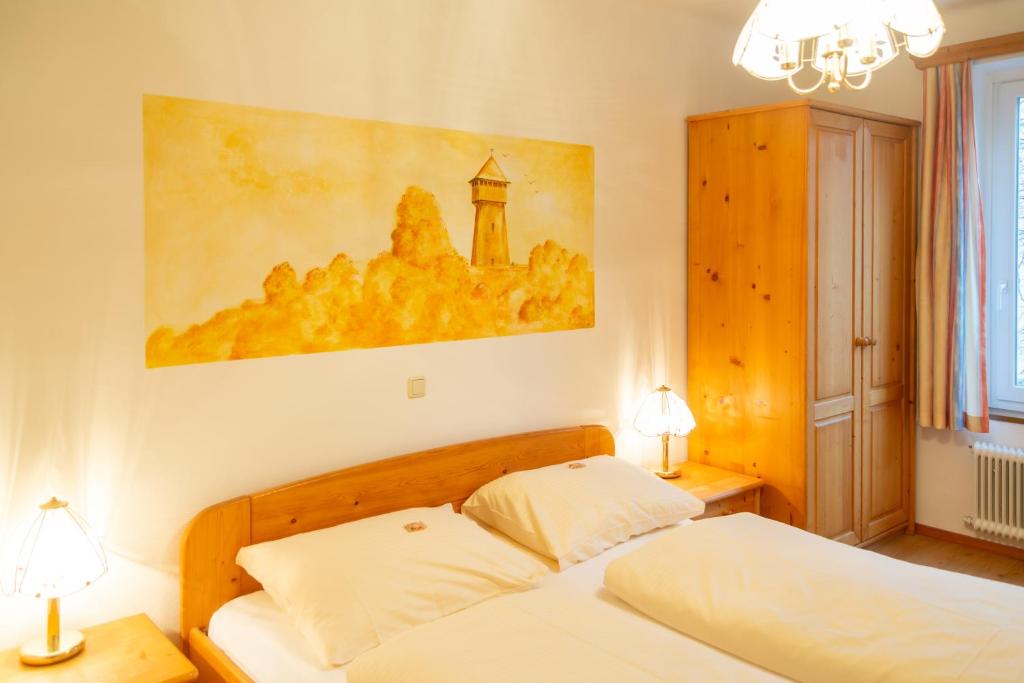 Postel nebo postele na pokoji v ubytování Hotel & Hostel Sandwirt