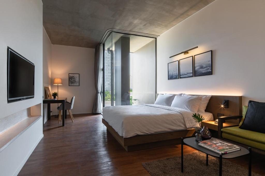 Ένα ή περισσότερα κρεβάτια σε δωμάτιο στο T2 Residence Sathorn