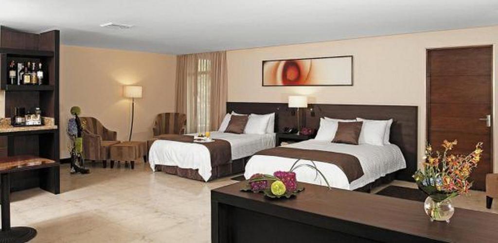 Postel nebo postele na pokoji v ubytování Studio Hotel Boutique