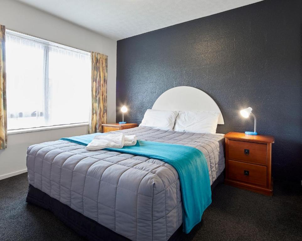 Postel nebo postele na pokoji v ubytování Aotea Motel