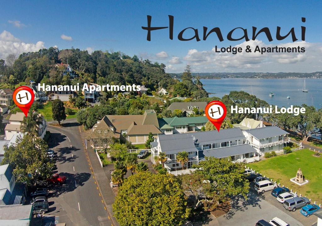 an aerial view of a town with red signs at Hananui Lodge and Apartments in Russell