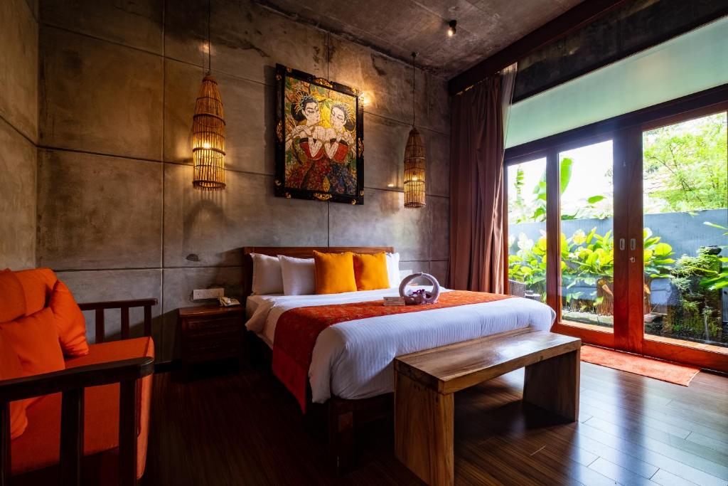 Postel nebo postele na pokoji v ubytování Ipoh Bali Hotel