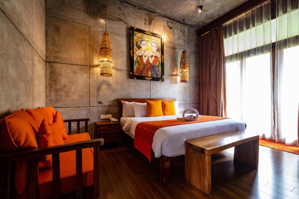 Postel nebo postele na pokoji v ubytování Ipoh Bali Hotel