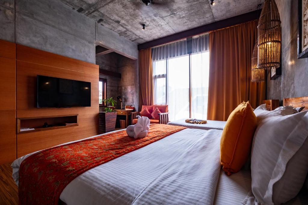 Postel nebo postele na pokoji v ubytování Ipoh Bali Hotel