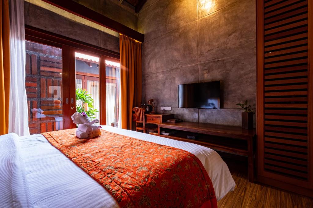 Postel nebo postele na pokoji v ubytování Ipoh Bali Hotel