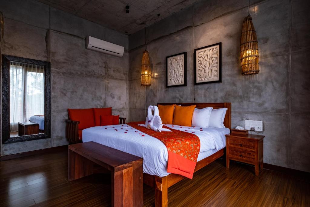 Postel nebo postele na pokoji v ubytování Ipoh Bali Hotel