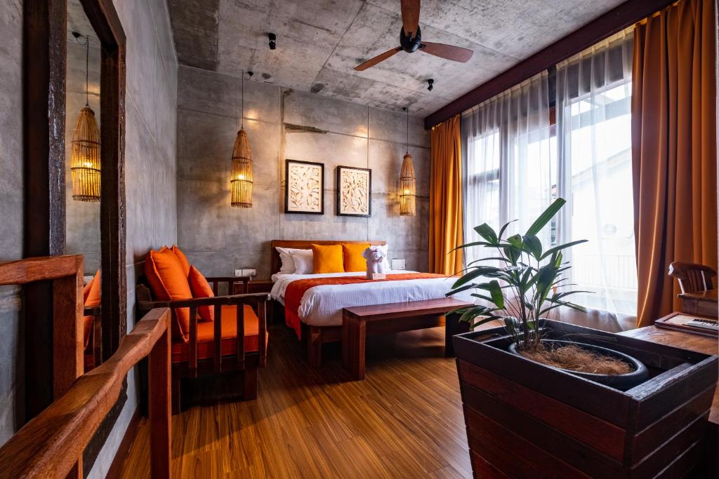Postel nebo postele na pokoji v ubytování Ipoh Bali Hotel