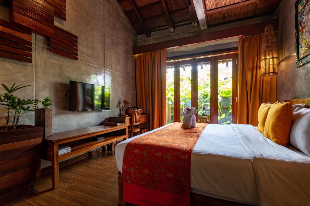 Postel nebo postele na pokoji v ubytování Ipoh Bali Hotel