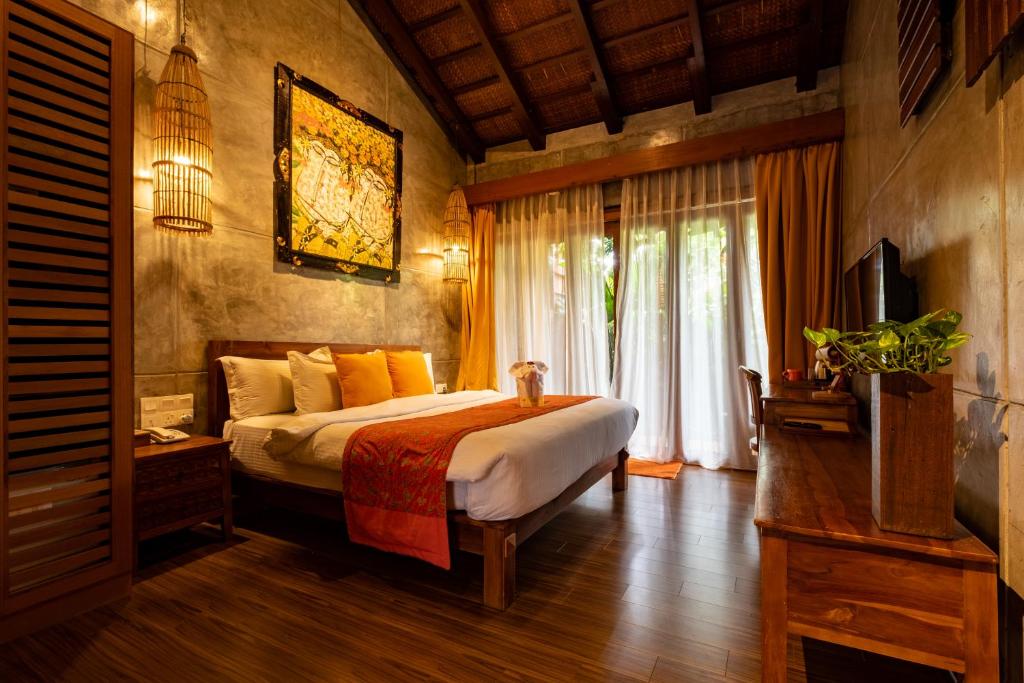 Postel nebo postele na pokoji v ubytování Ipoh Bali Hotel