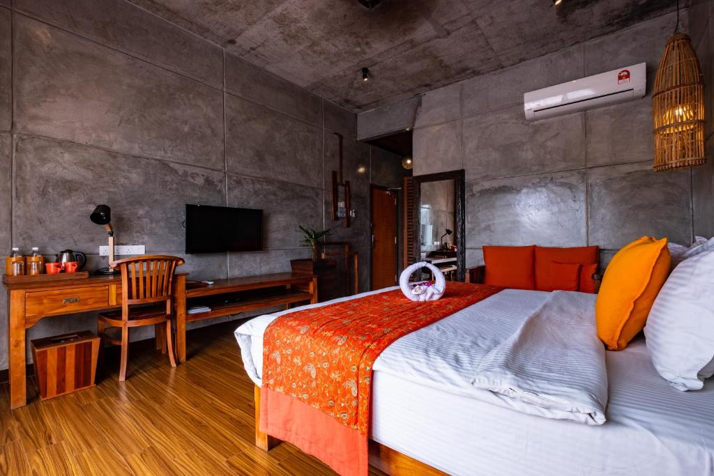 Postel nebo postele na pokoji v ubytování Ipoh Bali Hotel