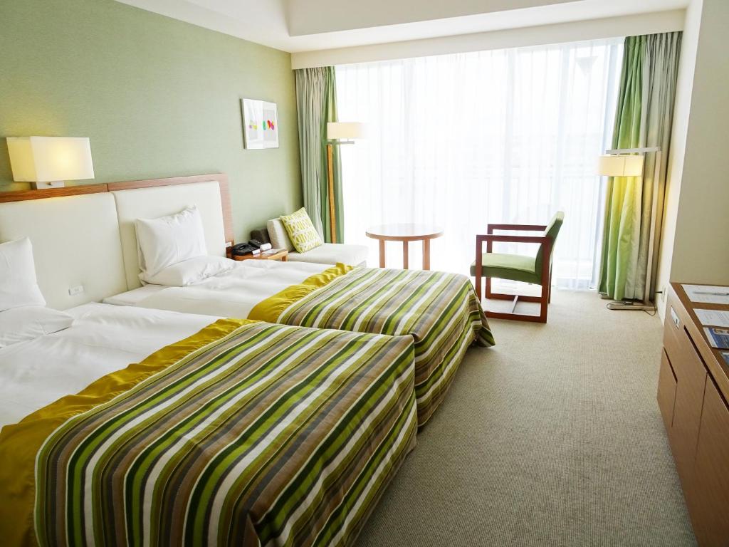 Postel nebo postele na pokoji v ubytování Southern Beach Hotel & Resort