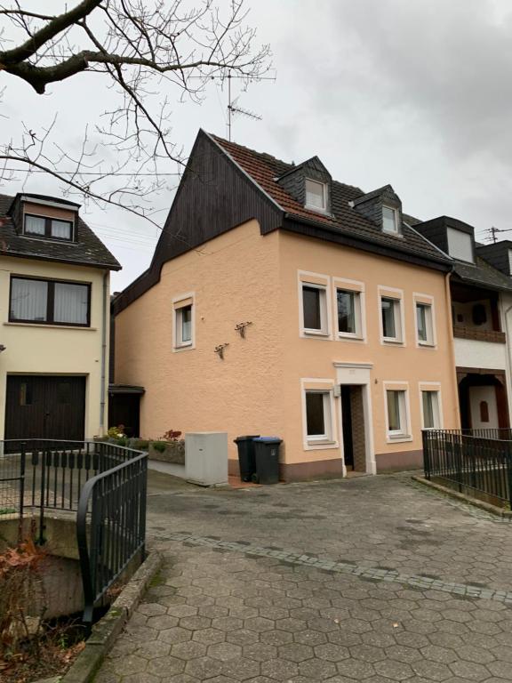 a large house with a driveway in front of it at Ferien Haus am Bach in Föhren