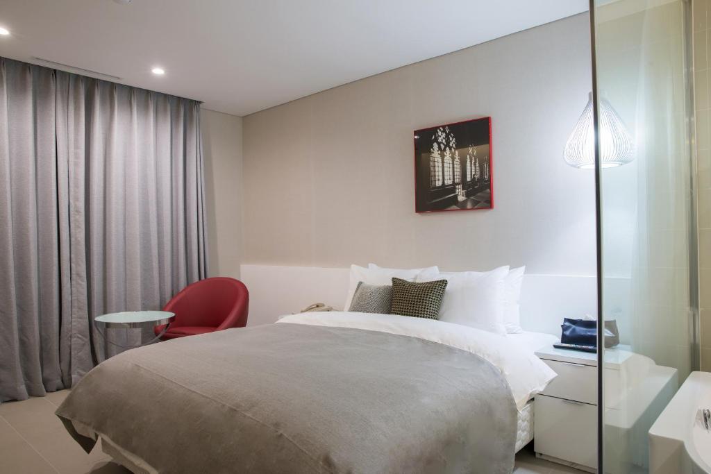 Postel nebo postele na pokoji v ubytování Hotel Mate Bundang